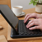 Picture of a person's hand typing on a keyboard